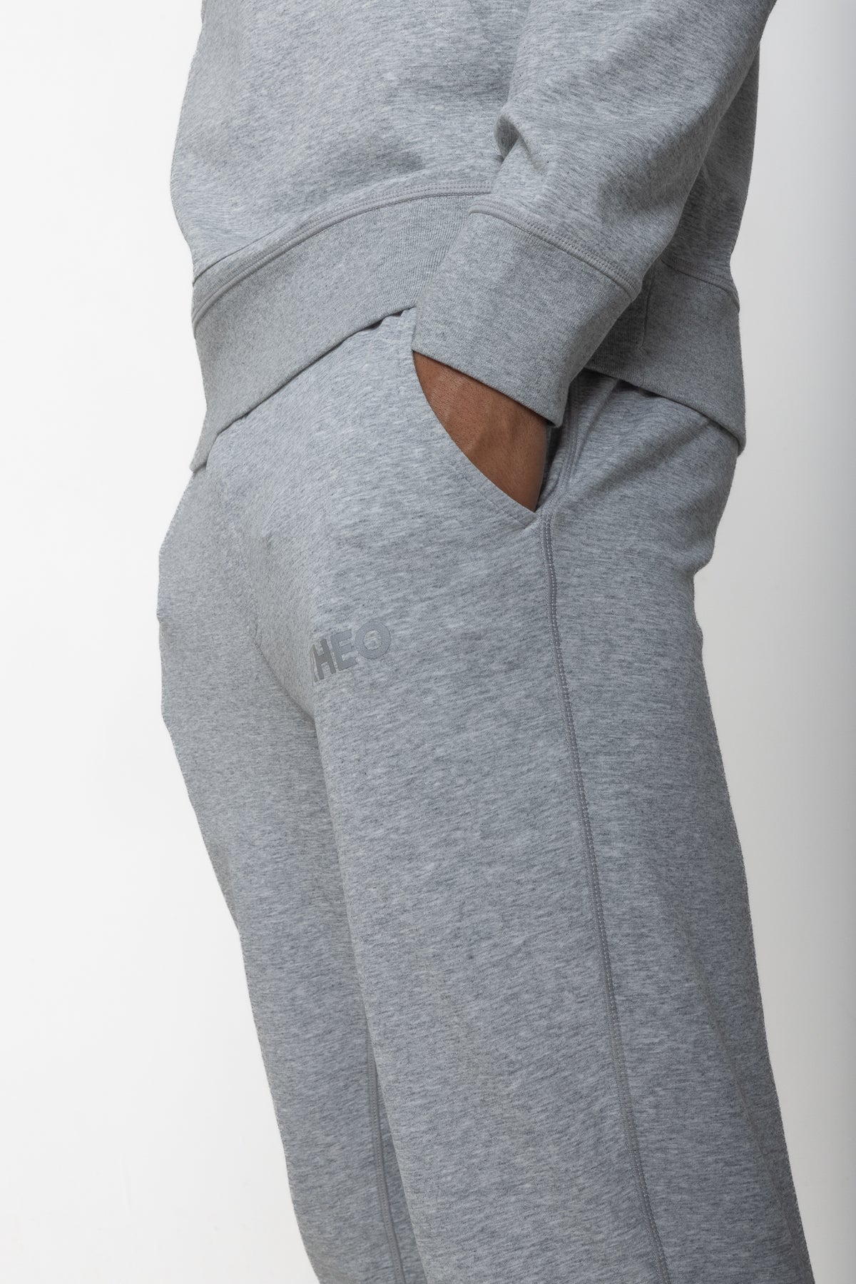 Close-up of grey RHEO CryoCotton™ Joggers showing the side pocket and RHEO logo.