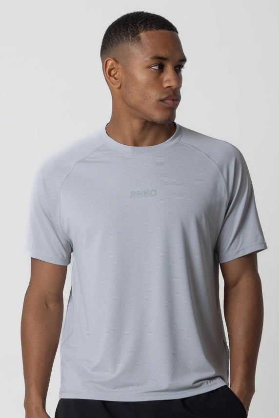 RHEO Core Performance Tee in light grey – lightweight men's gym t-shirt with breathable performance fabric.