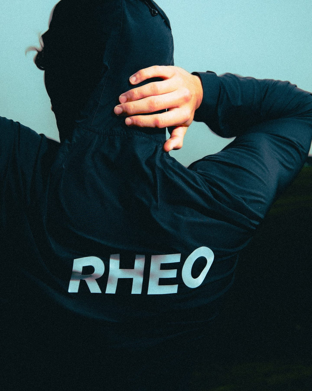 Reflective RHEO print on the back of the PebbleShell windbreaker